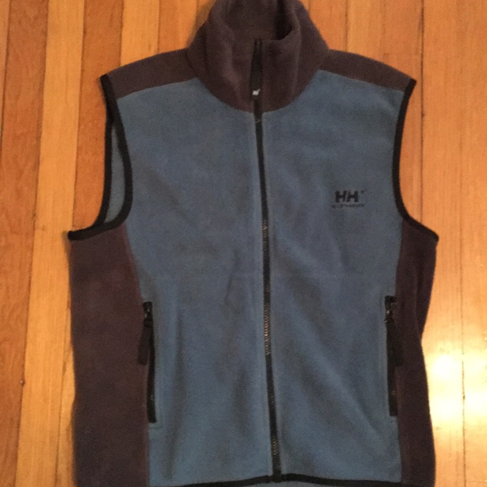 Blue fuzzy vest with partial grey.